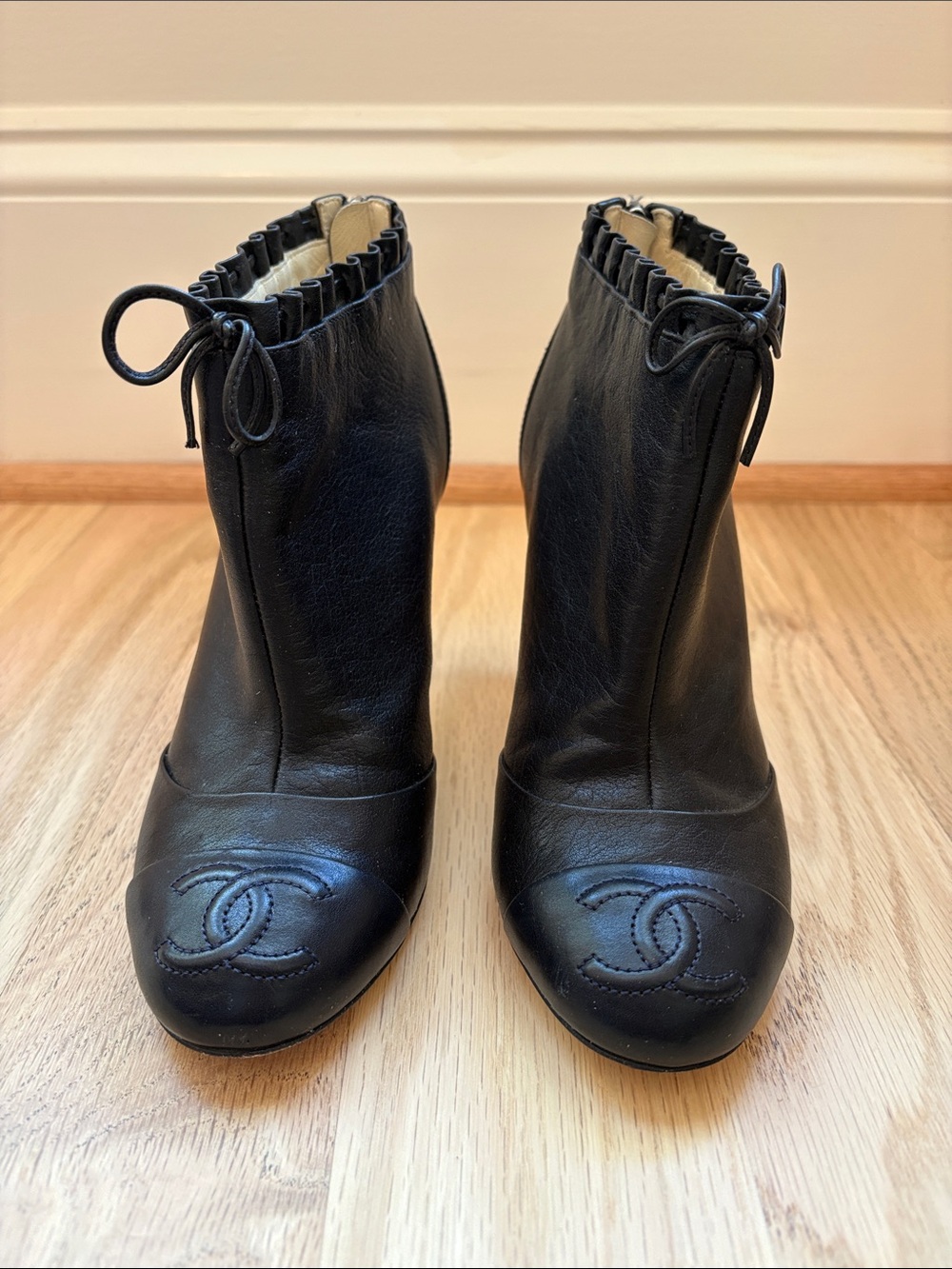 CHANEL Black Leather Ankle Booties with Bow-Trim and CC Toe